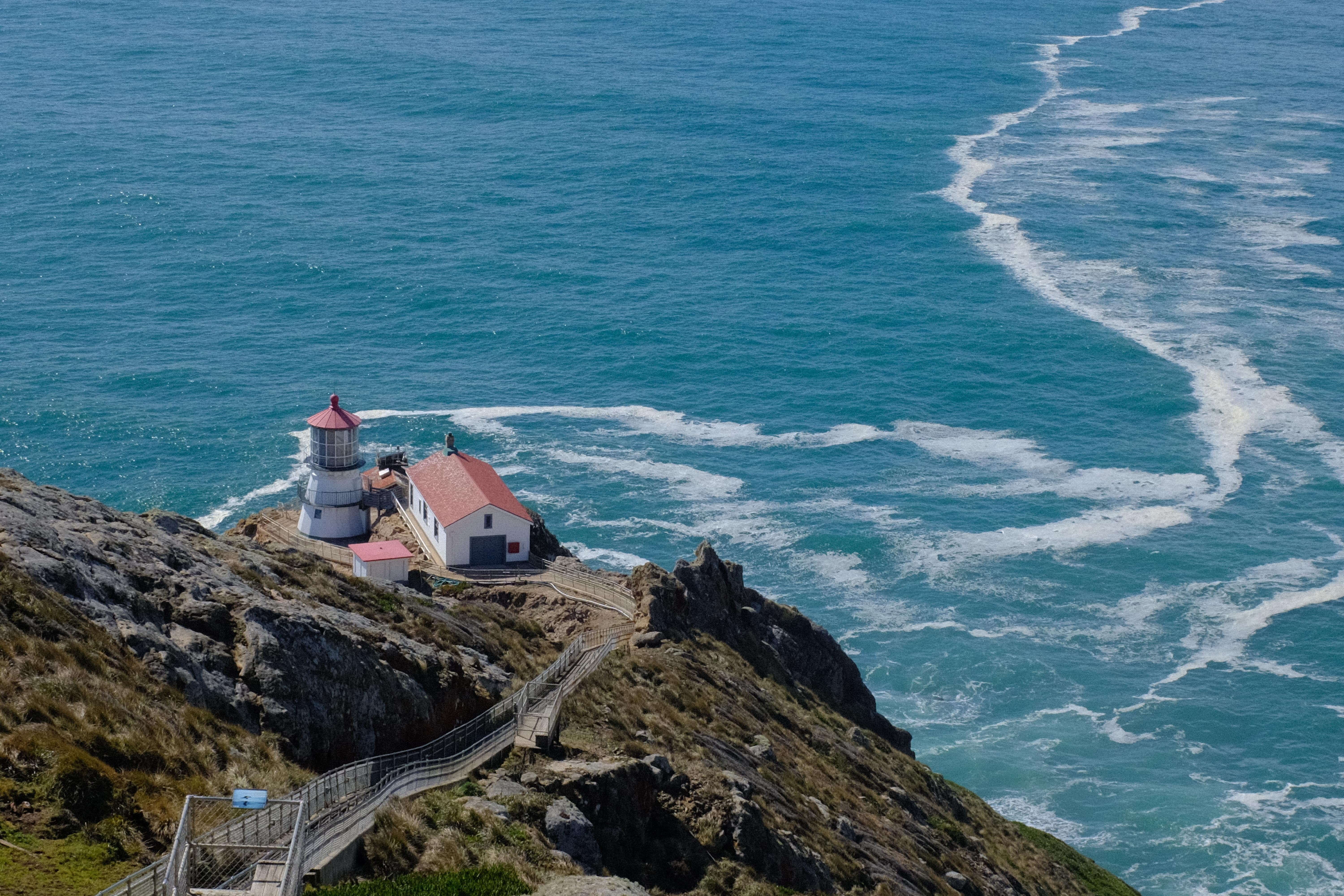 lighthouse on top of cliff